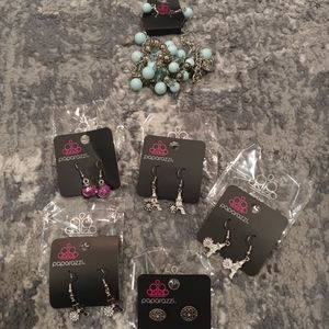 Paparazzi Jewelry Brand New. 5 pairs of earrings 1 light blue beaded necklace.